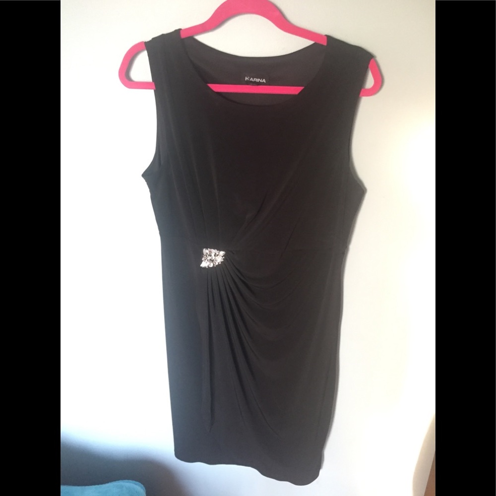 Black dress with side swipe and brooch